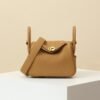 HERMES Lindy 19 Crossbody Bag in Biscuit Clemence Leather with Gold Hardware